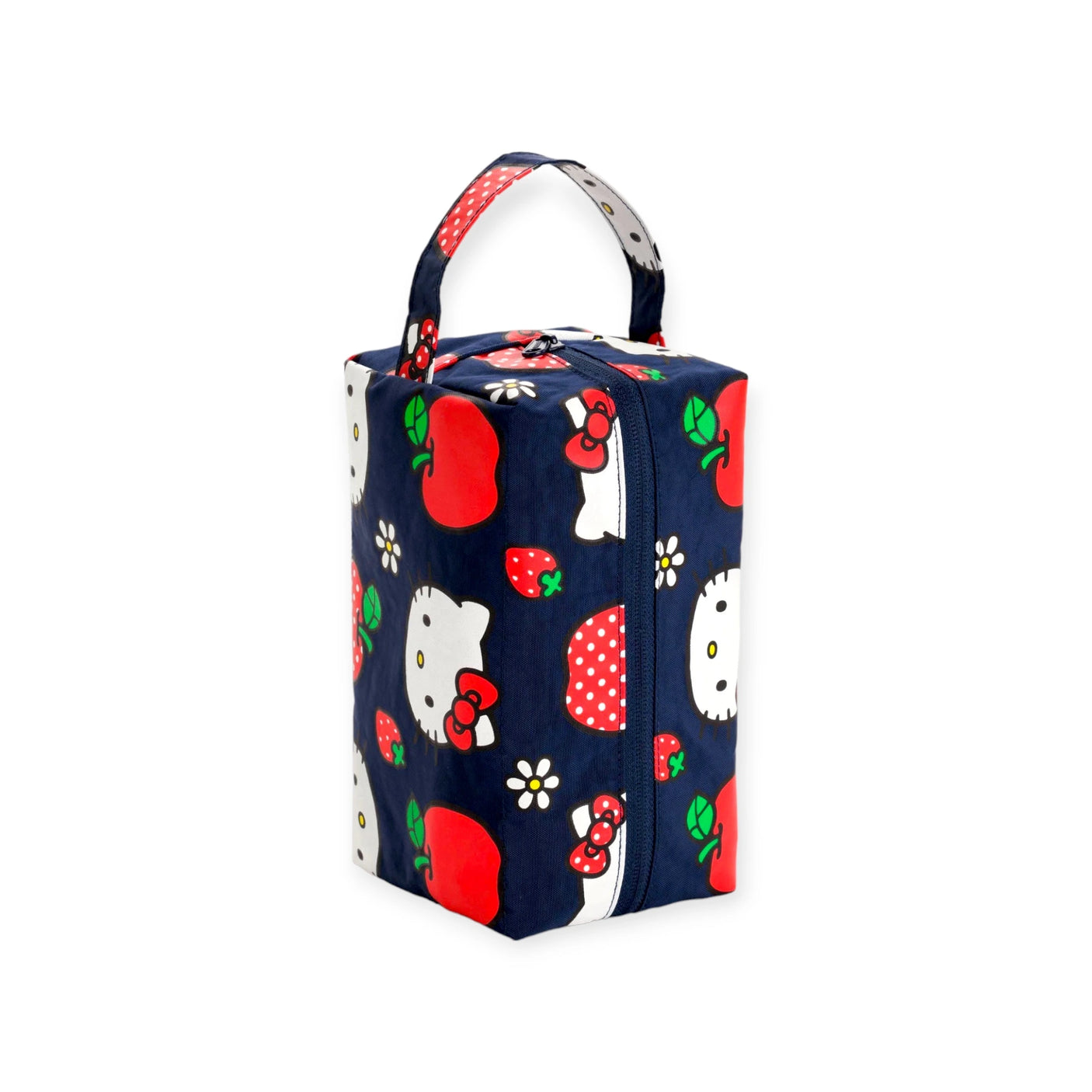 Introducing the Hello Kitty x Baggu Makeup & Toiletry Bag by Baggu: a rectangular bag crafted from recycled nylon, complete with a convenient handle. It boasts a navy blue background decorated with charming cartoon characters and whimsical red apples and strawberries, reminiscent of the iconic Hello Kitty Baggu design.