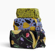 Baggu 3D storage travel set with three patterned pouches, folded and stacked for travel