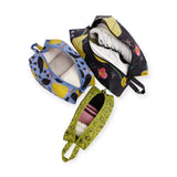 Baggu 3D storage travel set of three patterned pouches, one opened to show contents