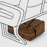A Baggu Small Cloud Carry-on - Leopard by Baggu sits under a stylized, black-and-white illustrated airplane seat.