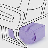 A Baggu Small Cloud Carry-on in Wisteria is shown under a seat, outlined in a simple line drawing style.