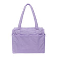 The Baggu Small Cloud Carry-on in Wisteria is a lavender underseat weekender bag by Baggu, featuring two shoulder straps and exterior pockets, displayed against a plain white background.