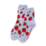 Pair of light purple ankle socks covered with red strawberry and white flower patterns on white background