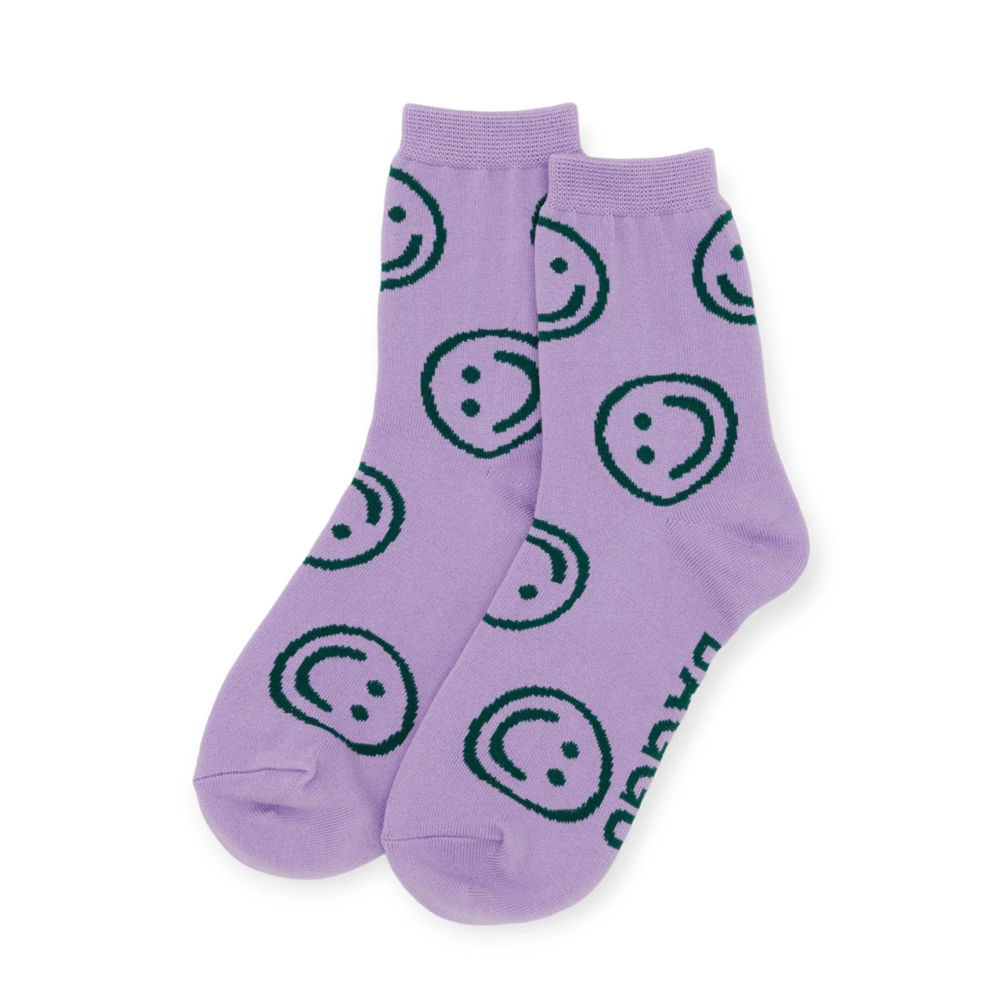 These Baggu Crew Sock - Lavender Happy from Baggu showcase a playful smiley face design in dark blue on a calming lavender backdrop. Crafted from bamboo rayon, they provide both a comfortable and eco-friendly choice for your feet.