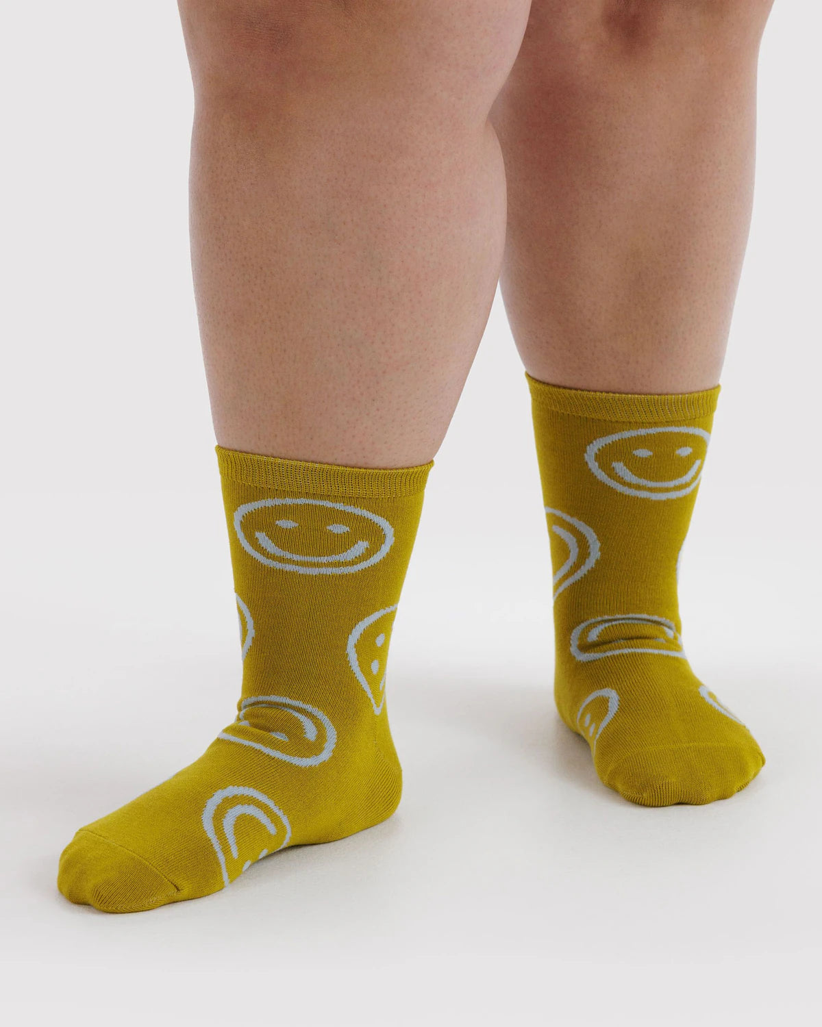 Ochre crew socks with white smiley face graphic