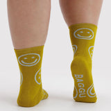Ochre crew socks with white smiley faces and BAGGU lettering