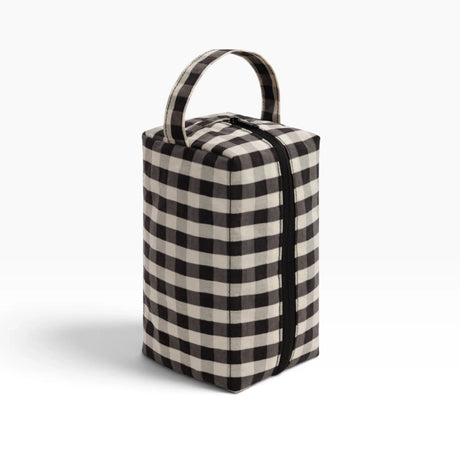 Black and cream gingham toiletry dopp kit with top handle and zip closure