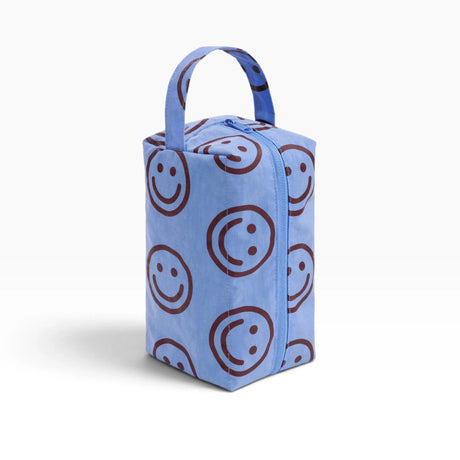 Light blue toiletry dopp kit with smiley print and carry handle, closed top