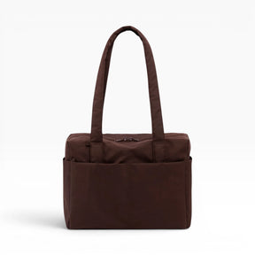 Brown canvas tote bag with flat top handles and center front panel