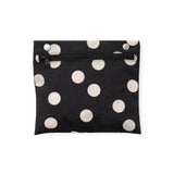 Black zipper pouch with cream polka dots, flat front view