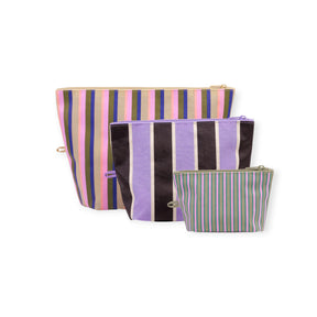 Three striped fabric zipper pouches in large, medium, and small sizes in pastel and dark tones on white background