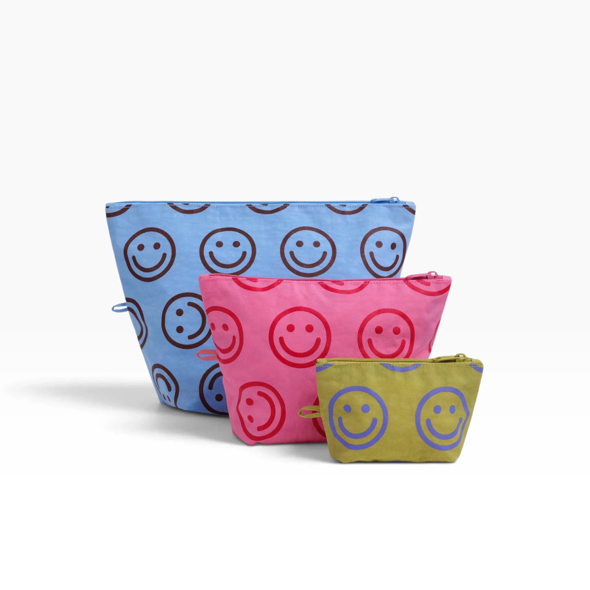 Three zip-top pouches in blue, pink, and olive with smiley faces pattern