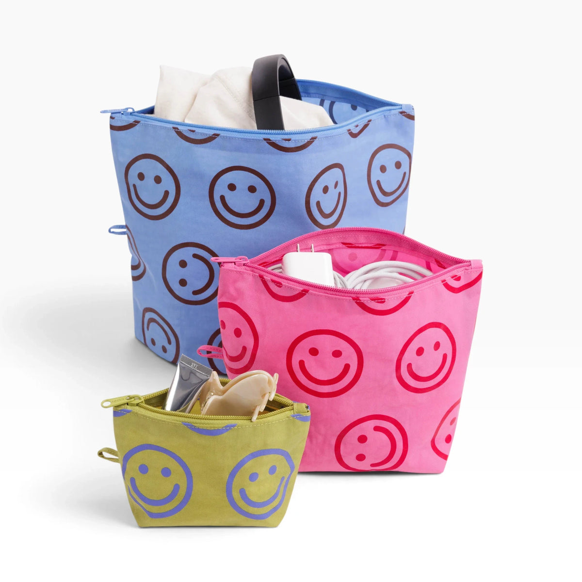 Open zip-top pouch set with smiley prints in blue, pink, and olive colors