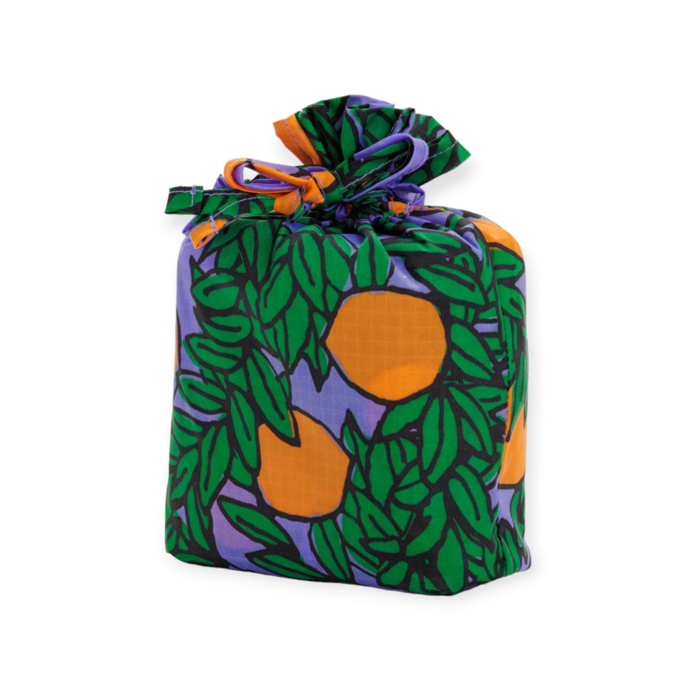 A Baggu set of three standard bags from the "Orange Trees" collection, featuring a vibrant design of orange fruits and green leaves on a purple background, is wrapped in eco-friendly fabric and tied at the top with a matching recycled nylon ribbon.