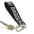 A Baggu Logo Keychain - Peony wrist strap crafted from recycled nylon webbing, featuring a silver metal clasp with keys attached.