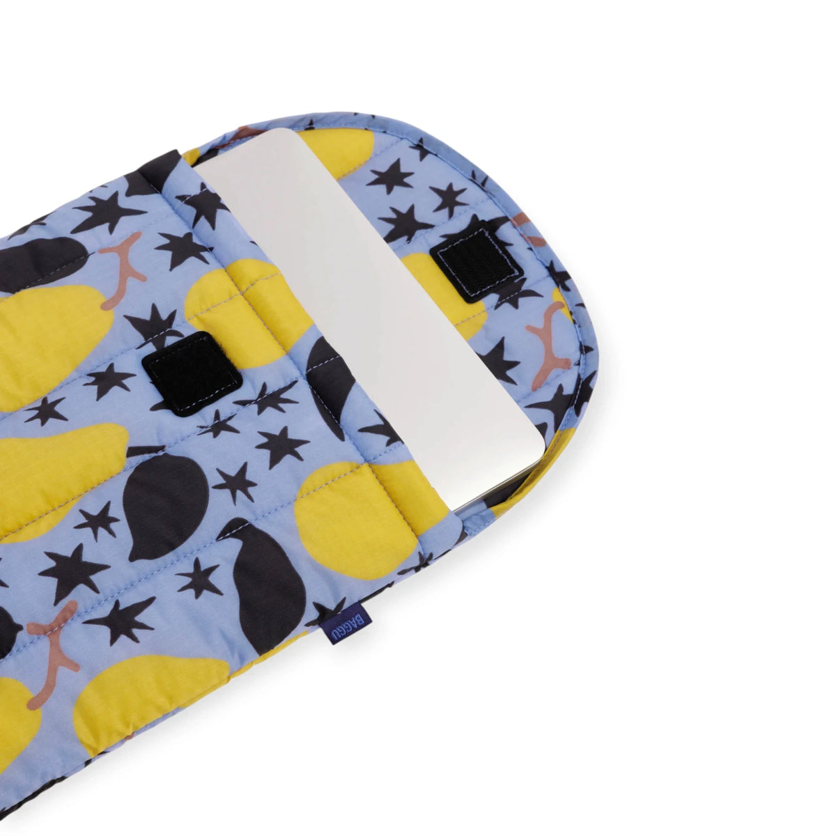 Laptop case interior with white lining, yellow pear print, and black label patches