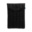 The Baggu Puffy Laptop Sleeve 16" in black provides padded protection with its recycled nylon construction and flap closure, displayed against a white background.