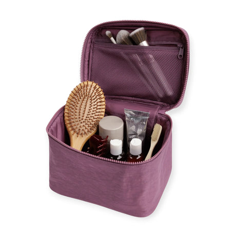 Wild plum large cosmetic case opened, showing mesh pocket and toiletries inside