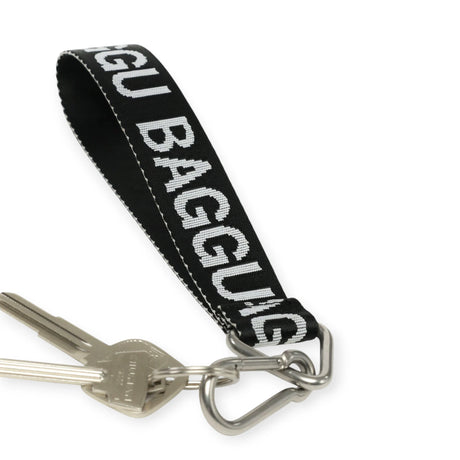 Black Baggu logo keychain with fabric strap and metal key ring clip