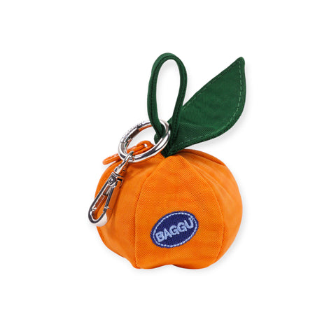 Compact orange fabric pouch shaped like a fruit with green leaf and metal clip attached to loop