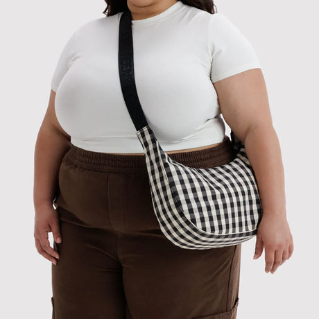 Black and cream gingham crescent crossbody bag with adjustable strap