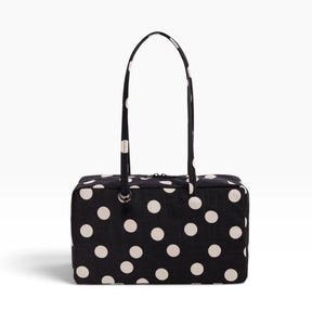 Medium nylon bowler bag in black with cream polka dots, top zipper and handles