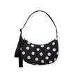 Medium nylon crescent bag with black fabric and cream polka dots, top handle.