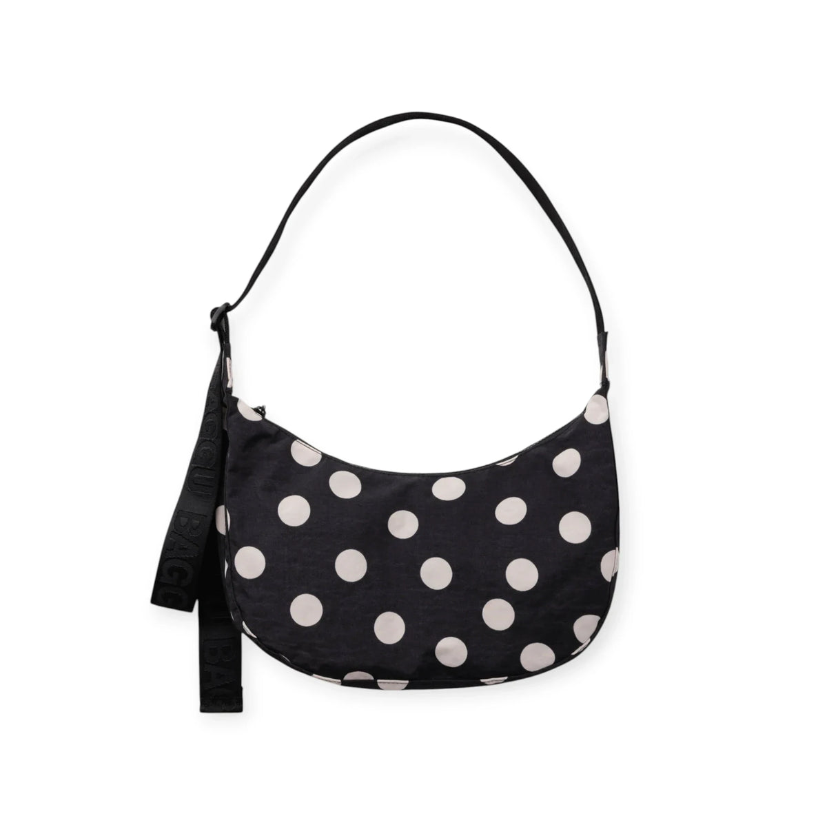 Medium nylon crescent bag with black fabric and cream polka dots, top handle.