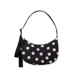 Medium nylon crescent bag with black fabric and cream polka dots, top handle.
