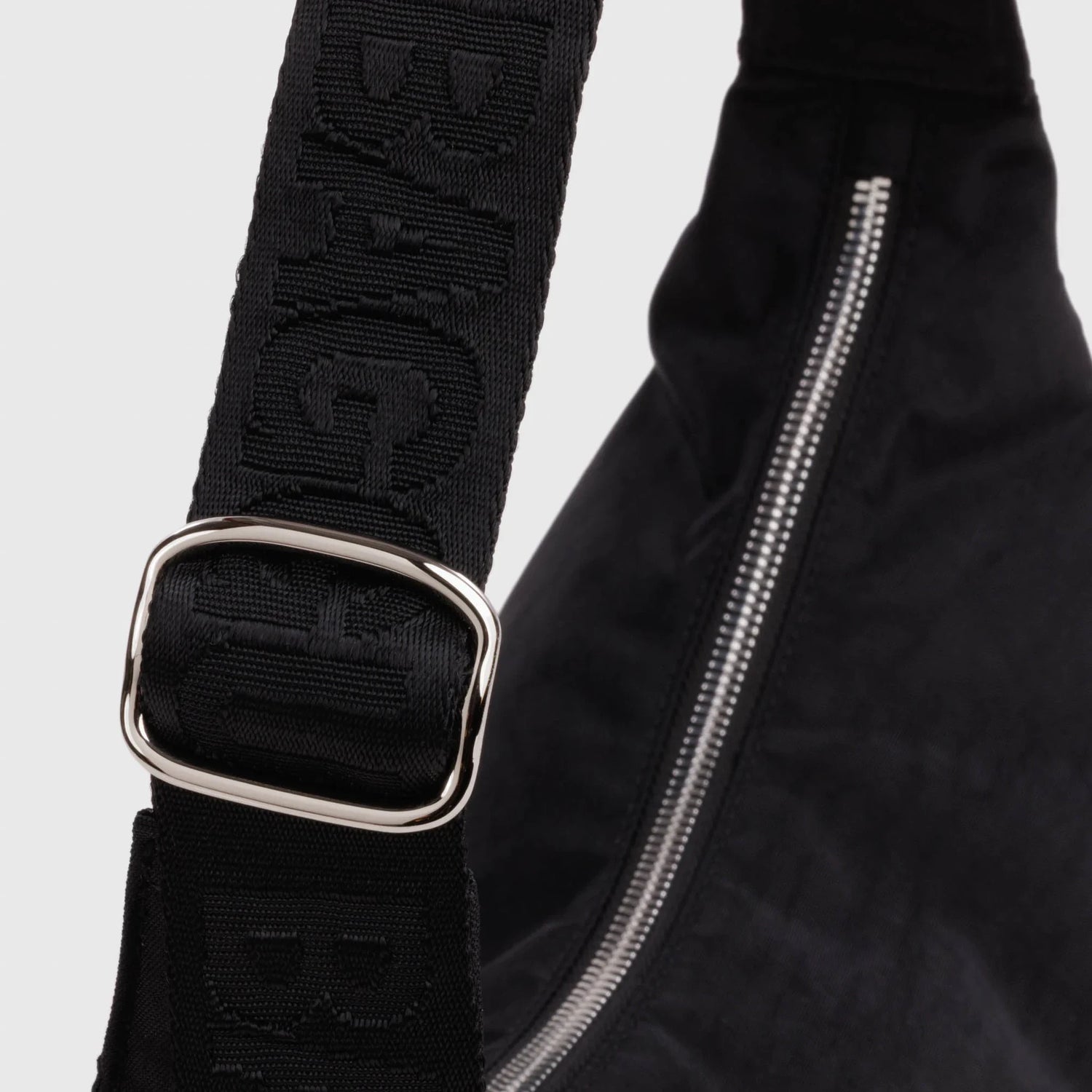 Nylon crescent bag strap with adjustable buckle and studded band