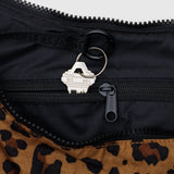 Inside the chic Baggu Medium Nylon Crescent Bag - Leopard, your keys can be safely attached to the zipper pull, making it ideal for everyday use.