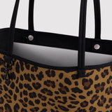 Medium nylon reversible tote with leopard-print fabric and black web handles