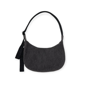 Baggu Medium Crescent Bag in washed black denim with adjustable black strap and minimalistic design, gallery position 1