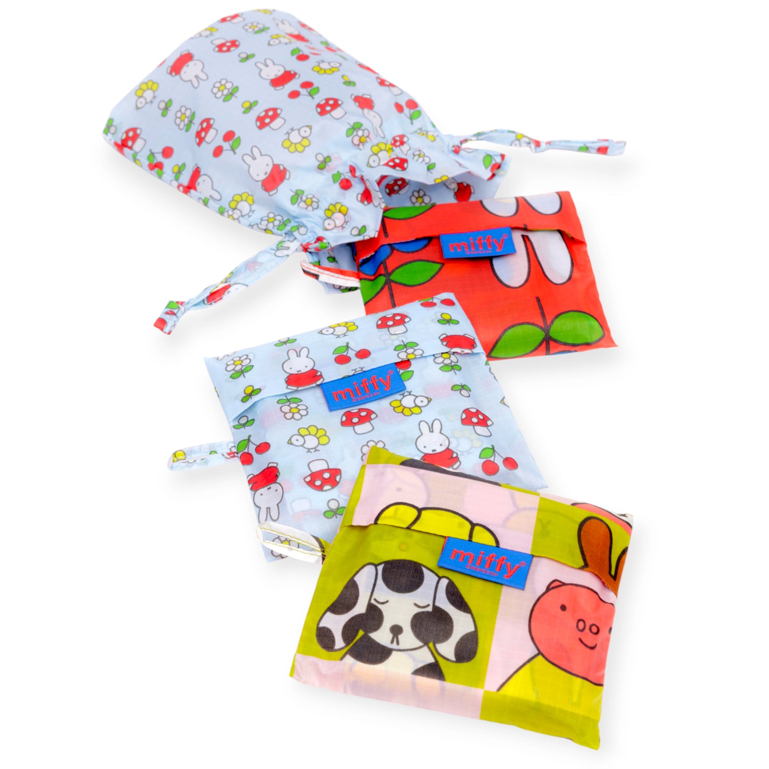 Three folded fabric pouches with vibrant animal and floral prints and "miffy" labels are shown next to a matching Baggu x Miffy Standard Set of 3 Bags by Baggu.