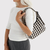 Black-and-cream gingham mini shoulder bag, carried on shoulder with strap