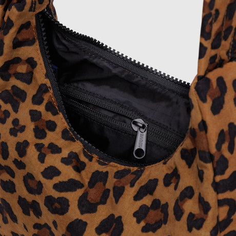 Close-up of leopard print Mini Nylon Shoulder Bag interior showing black zippered pocket and fabric lining