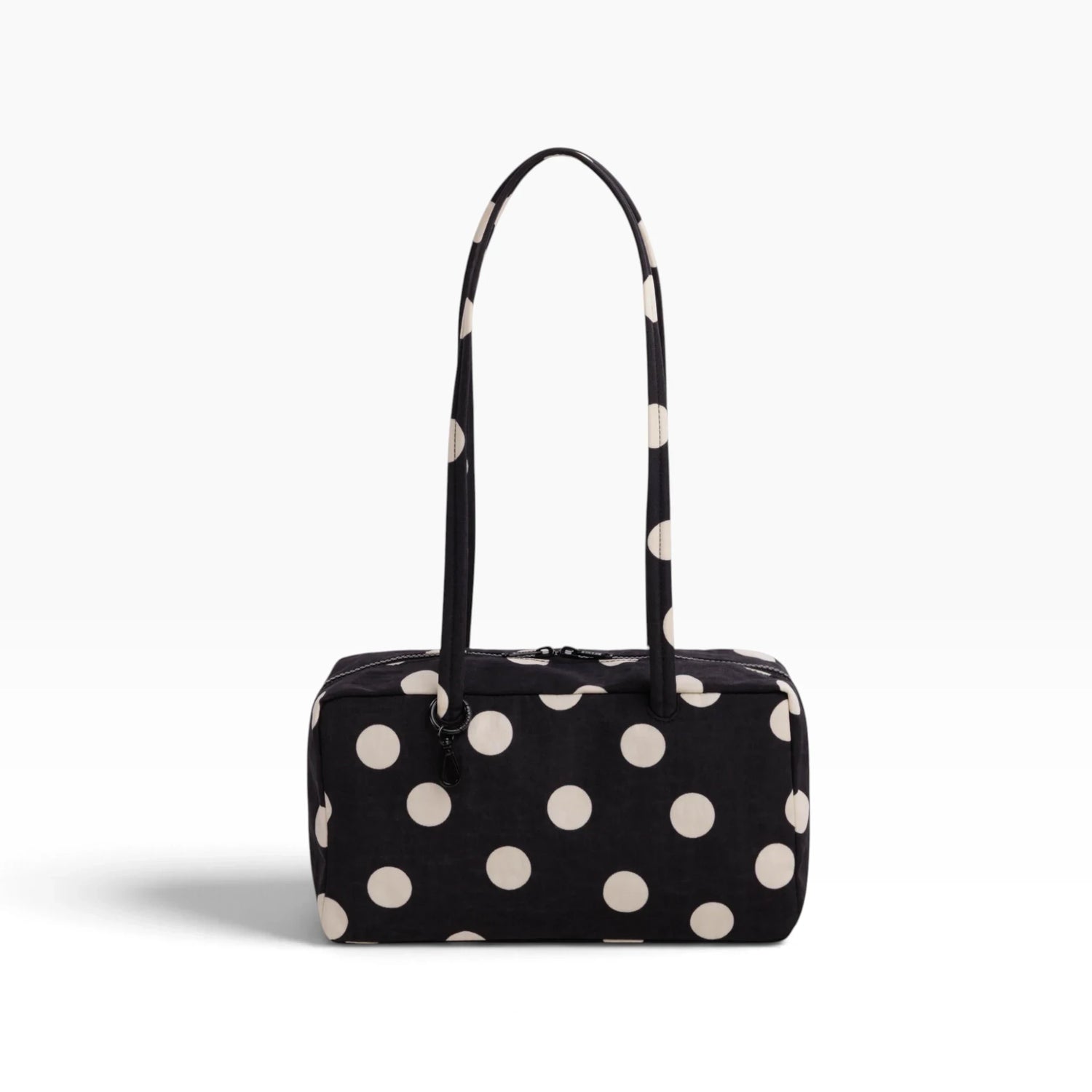 Black nylon bowler bag with cream polka dots, top handles, front zipper pocket.