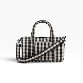 Gingham nylon duffle bag with black handles and shoulder strap, black-and-cream plaid