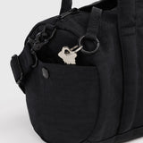 Black nylon duffle bag with front snap pocket and metal D-ring key holder