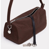Coffee-brown nylon loaf bag with front zipper, metal rings, and key-fob charm