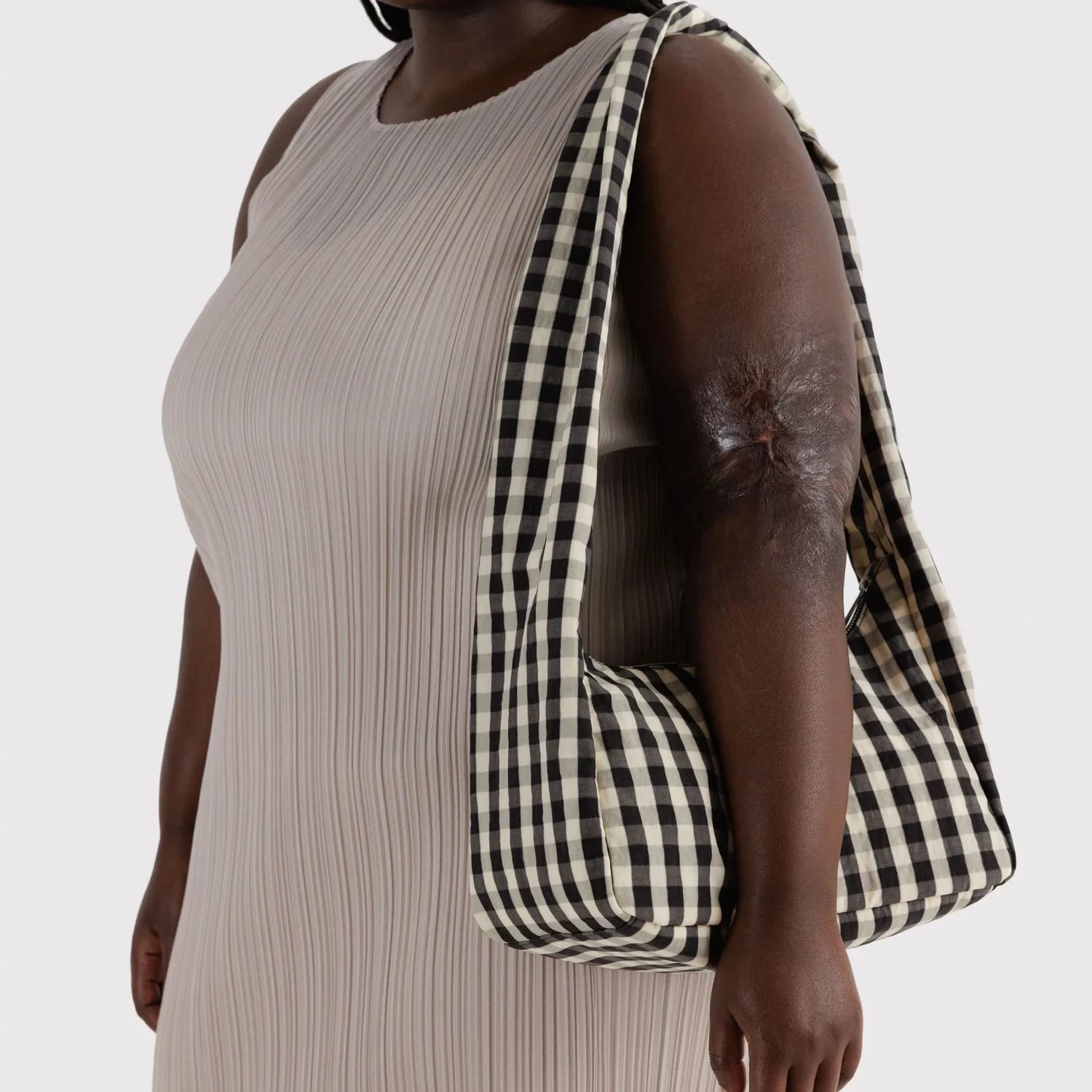 Black-and-cream gingham nylon hobo bag with long shoulder strap