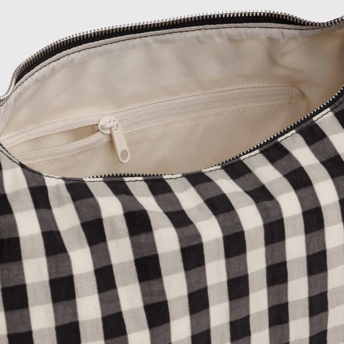 Gingham nylon bag interior with cream lining and zip closure