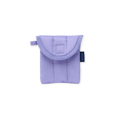 The Baggu Puffy Earbuds Case - Wisteria is a small, pastel purple quilted case with a flap closure and blue "BAGGU" tag, shown against a white background.