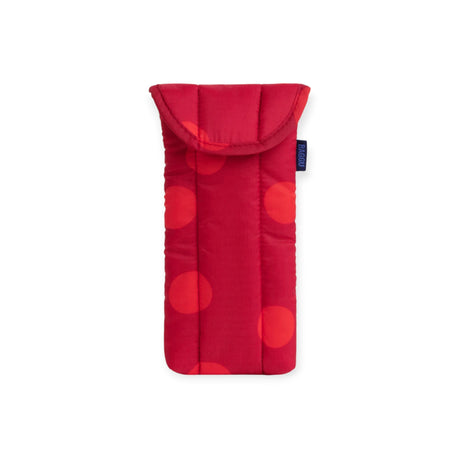 Red puffy glasses case with dark polka dots, top flap, and blue logo label