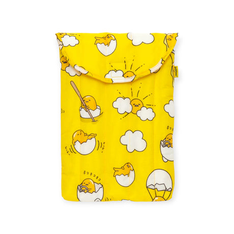 The Gudetama x Baggu Puffy Laptop Sleeve (13"/14") from Baggu showcases a delightful array of Gudetama illustrations, including scenes of the character emerging from an egg and relaxing on clouds. This vibrant yellow pouch makes for a charming laptop sleeve or fun accessory for devotees of the lazy egg.