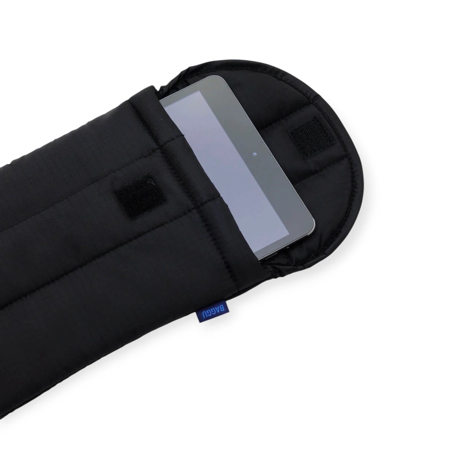 The Baggu Puffy 8" Tablet Sleeve - Black by Baggu, made from recycled nylon, is shown partially open with a tablet inside. It features Velcro flap closure and a small blue edge tag for added protection.