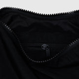 Black nylon crescent bag interior with zippered pocket and zipper pull