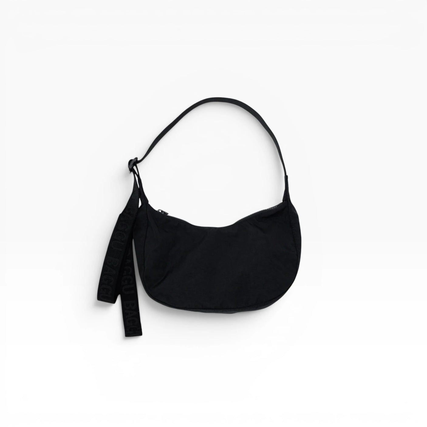 Black small nylon crescent bag with drawstring strap and tassel pull
