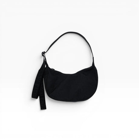 Black Baggu small nylon crescent bag with drawstring strap and dangling key tag