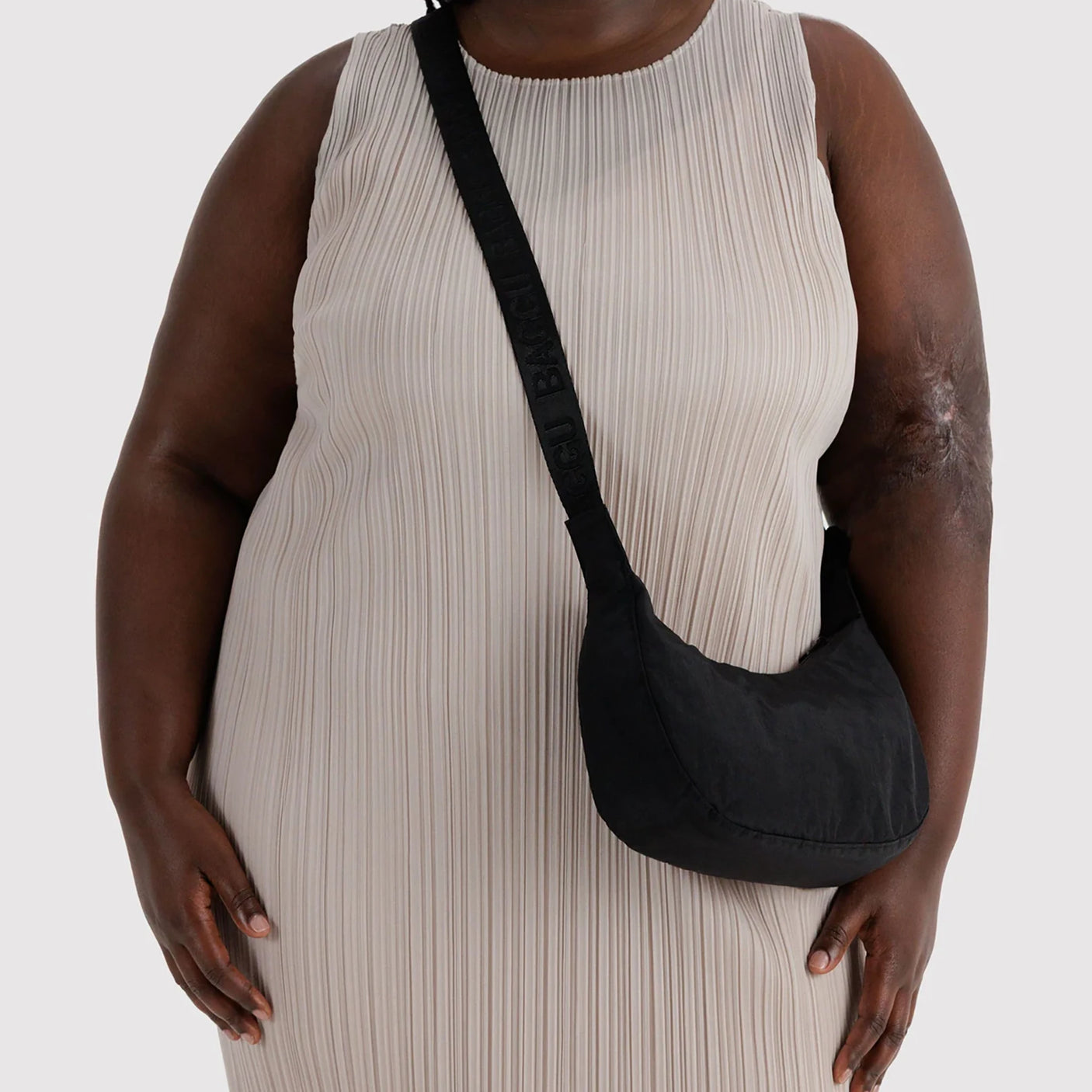 Black nylon crescent crossbody bag with adjustable strap